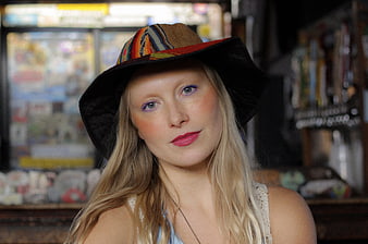 Portrait of Blonde Woman in Colorful Hat with Makeup