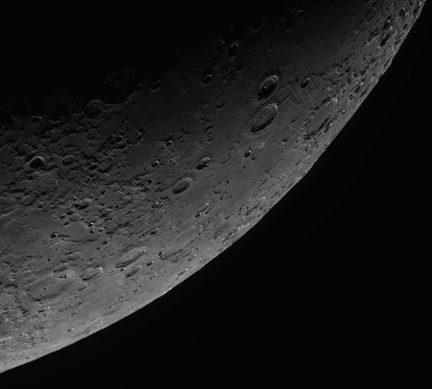 Close-up of Moon Surface with Craters and Shadows