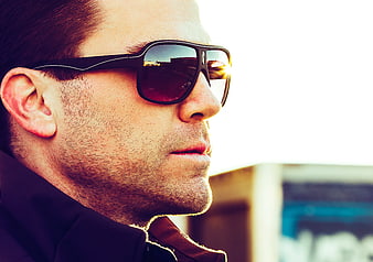 Close-up of man wearing stylish sunglasses outdoors