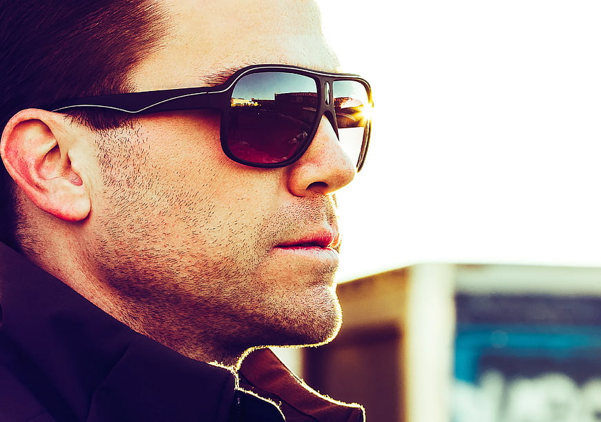 Close-up of man wearing stylish sunglasses outdoors