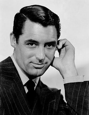Vintage black and white portrait of Cary Grant in pinstripe suit