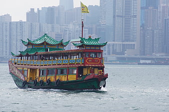 Traditional Chinese Junk Boat Cruising Hong Kong Harbor