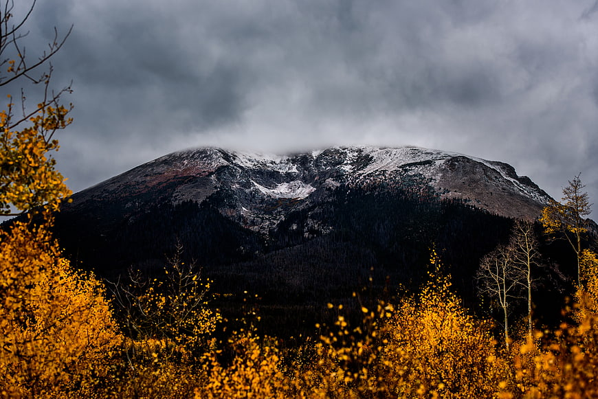 Snow-Capped Mountain Peak with Golden Autumn Aspen Forest