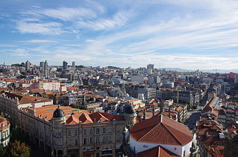 Aerial View of Porto Cityscape with Red Roofs and Blue Sky