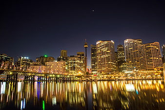 Sydney skyline at night with reflections on water