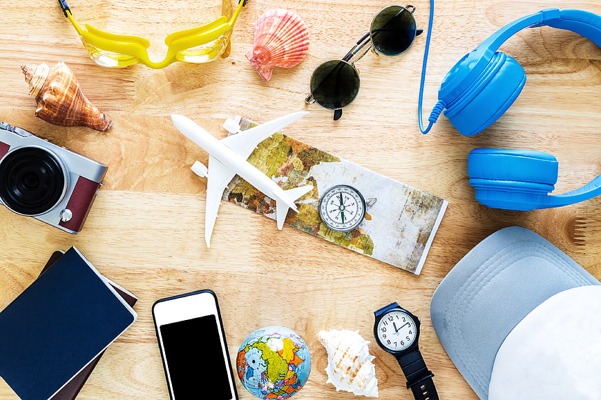 Summer Travel Accessories Flat Lay on Wooden Background