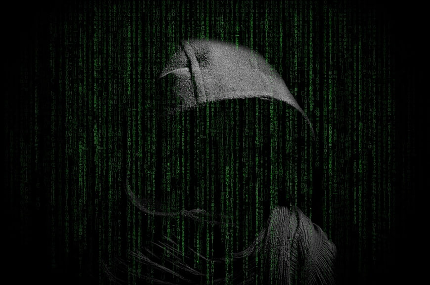 Hacker in Hoodie with Matrix Code Background
