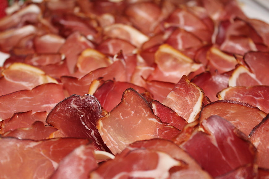Close-up of sliced cured ham on a platter