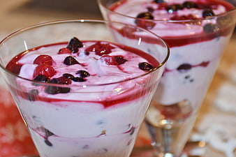 Close-up of berry yogurt parfait in glass cups
