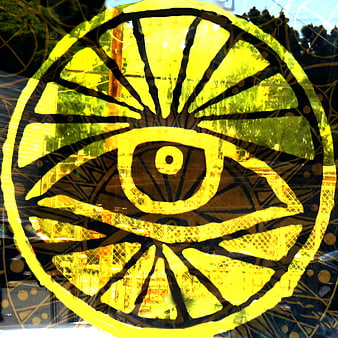 Yellow Evil Eye Symbol on Glass Window