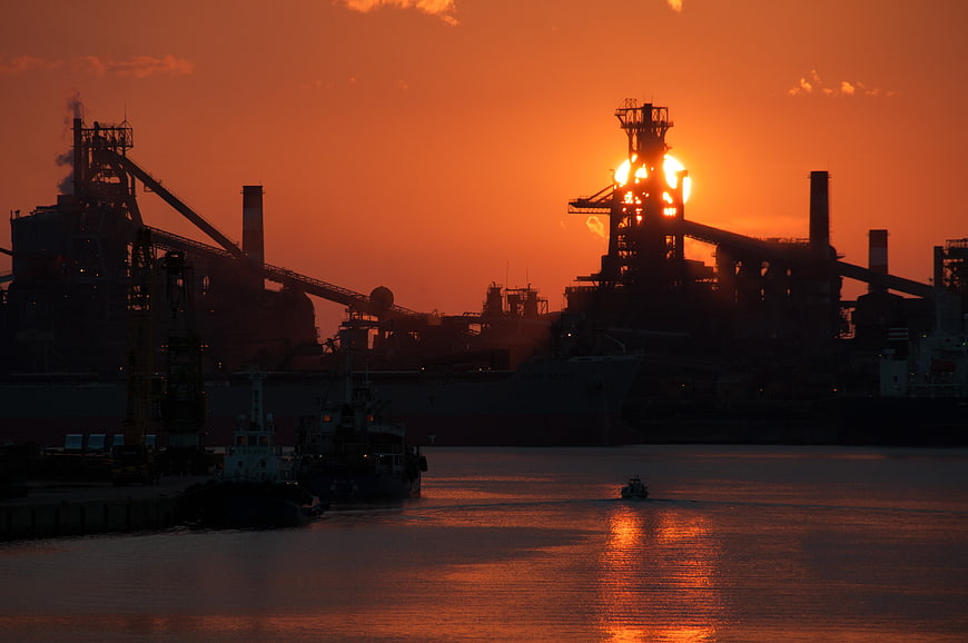 Industrial Port Silhouette at Sunset with Orange Sky