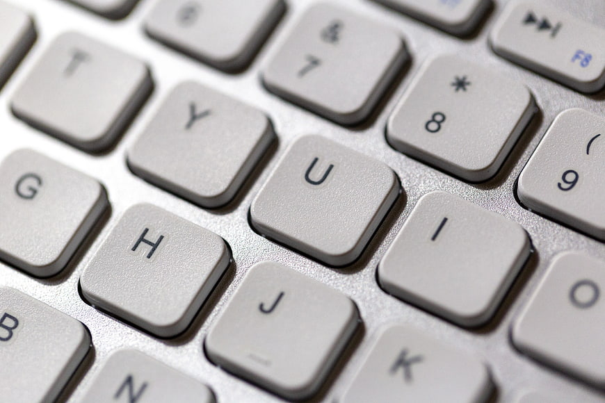 Close-up of white laptop keyboard keys