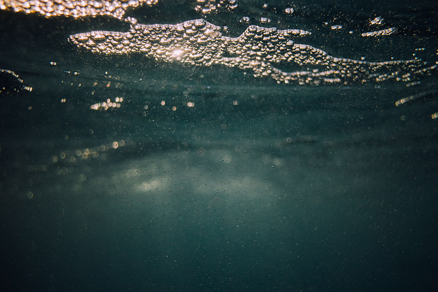 Underwater Ocean Surface with Sunlight and Bubbles