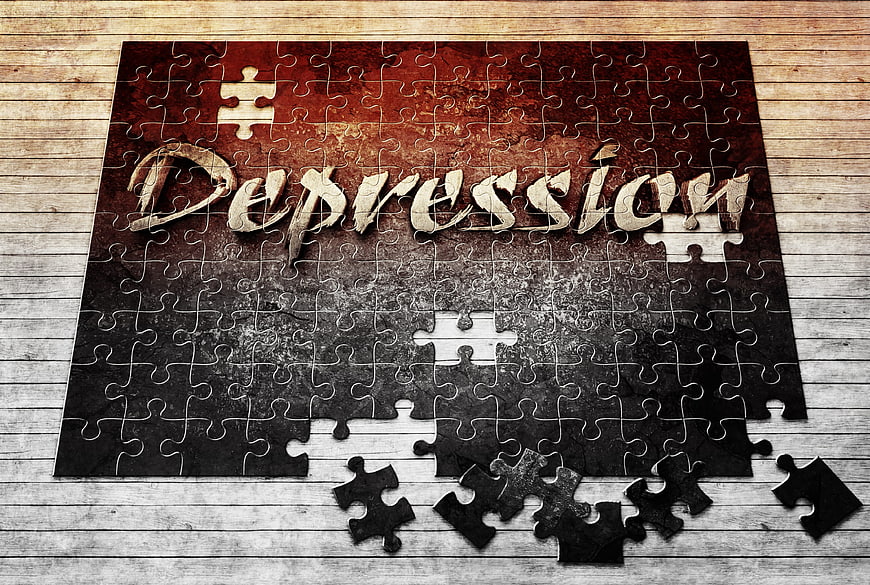 Depression Concept with Missing Puzzle Pieces on Wood