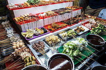 Variety of Malaysian Lok Lok street food skewers and ingredients