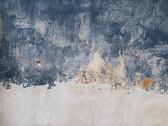 Abstract textured wall background with blue and beige paint
