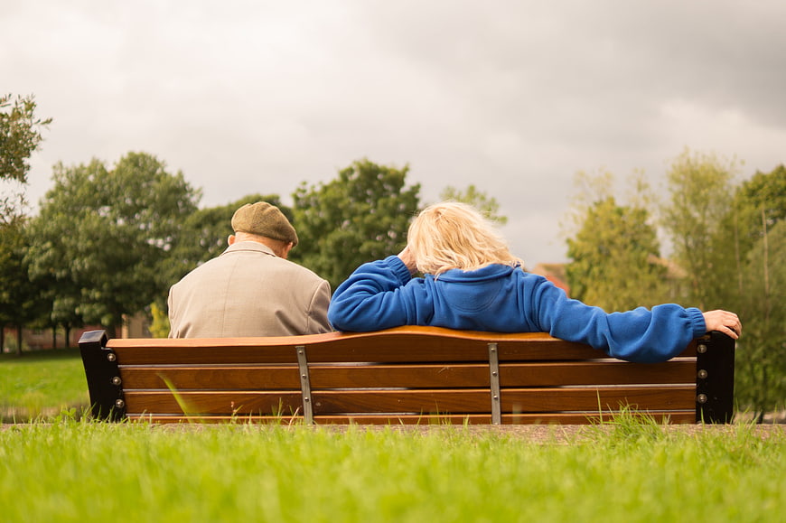 Senior Couple Relaxing on Park Bench