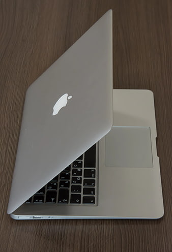 Silver MacBook Laptop on Wooden Desk