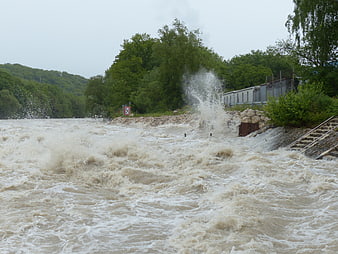Powerful River Flood With Turbulent Waves And Splash