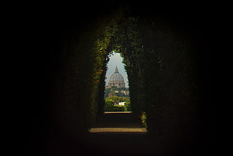 St. Peter's Basilica View Through Dark Garden Tunnel