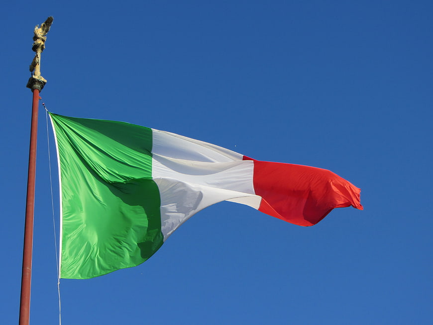 Italian Flag Waving Against Clear Blue Sky