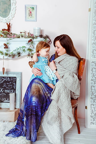 Mother and Toddler Daughter in Christmas Setting