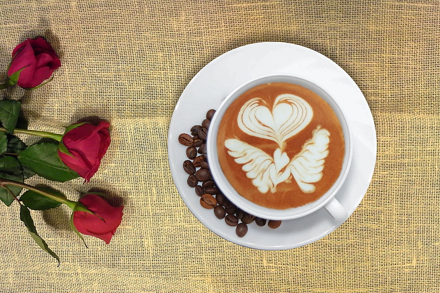 Top View Cappuccino with Heart Latte Art and Red Roses