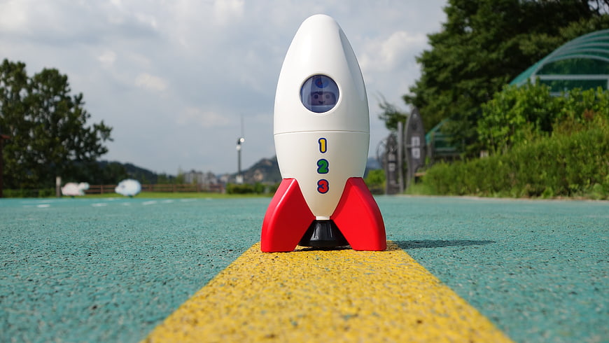 Toy Rocket Ship On Playground Path