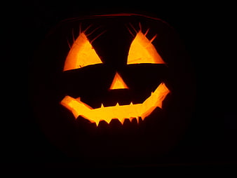 Classic Glowing Jack-O'-Lantern on Black Background
