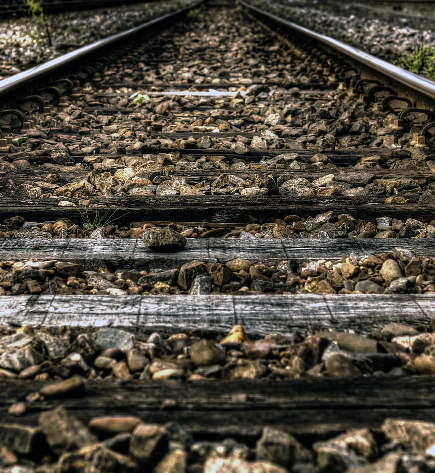 Close-up Railway Tracks with Gravel and Wooden Sleepers