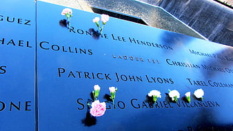 Flowers on World Trade Center Memorial Name Plaque