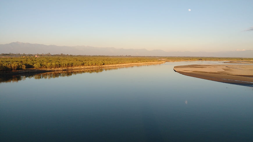 Serene River Landscape with Moon and Mountain Reflection