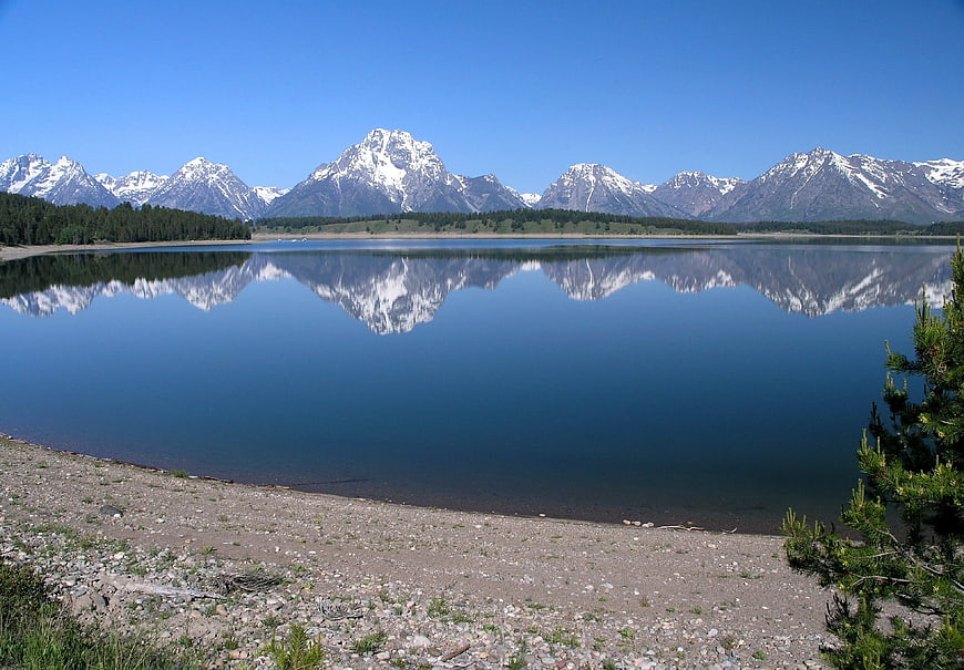 Snowy Mountain Range Reflected in Calm Lake