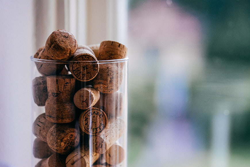 Glass Jar Filled with Wine Corks by Window