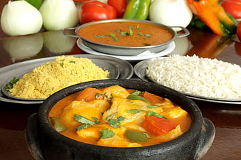 Brazilian Fish Stew with Rice and Pirão on Wooden Table