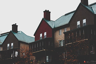 Modern Apartment Buildings with Green Metal Roofs