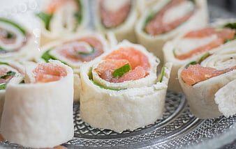Smoked salmon pinwheels on silver platter