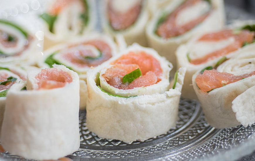 Smoked salmon pinwheels on silver platter
