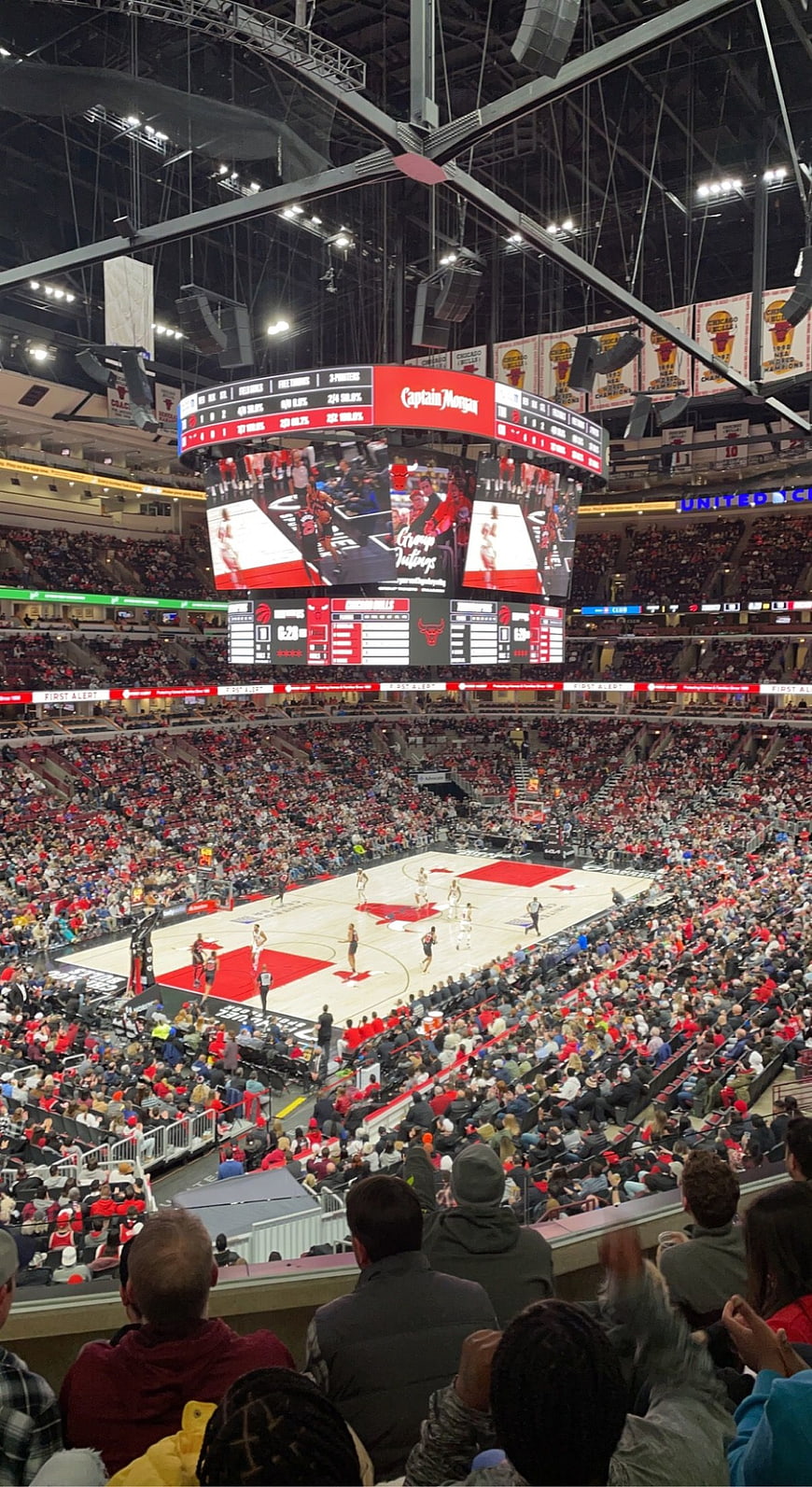 Wide View of NBA Basketball Game in Packed Arena