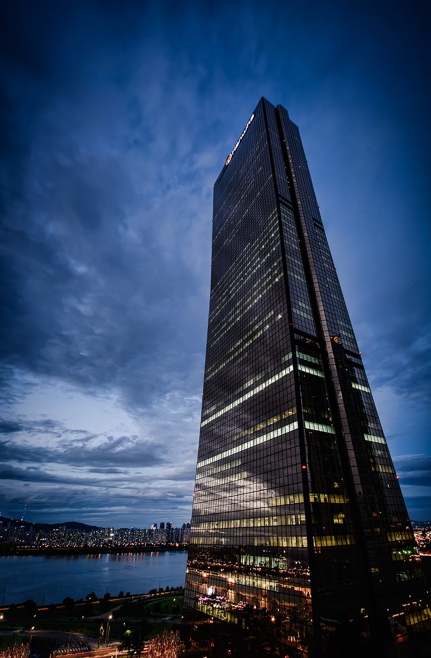 Modern Skyscraper at Dusk with Dramatic Blue Sky
