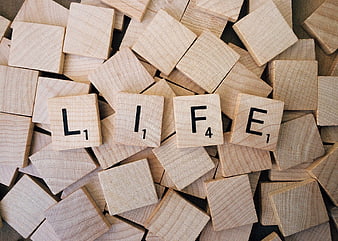 Life Word Spelled With Scrabble Tiles On Wooden Background