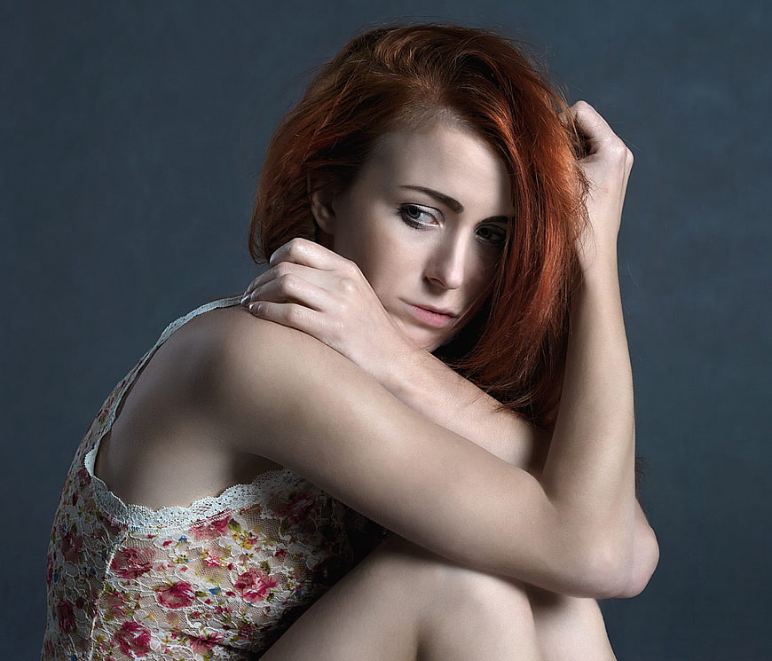 Pensive Redhead Woman in Floral Lace Top Portrait
