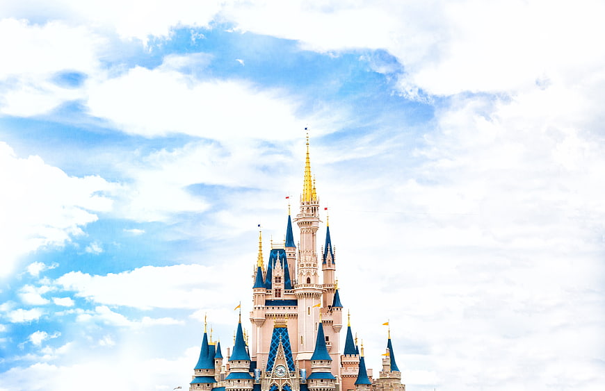 Cinderella Castle against blue sky with clouds