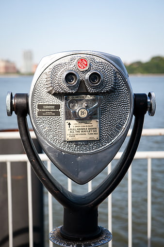 Close-up of Coin-Operated Binoculars by the Water
