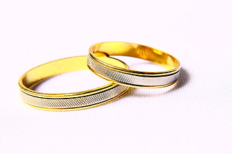 Gold and Silver Wedding Bands on White Background