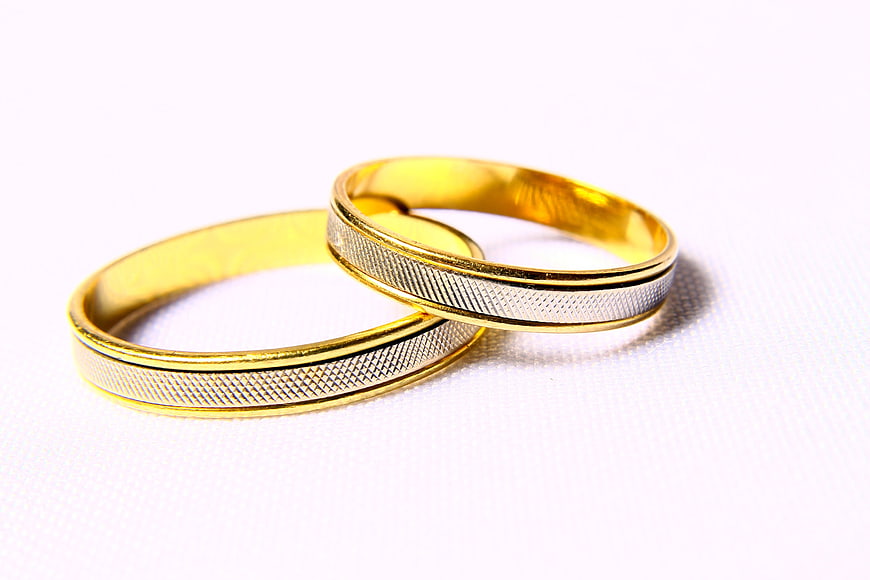 Gold and Silver Wedding Bands on White Background