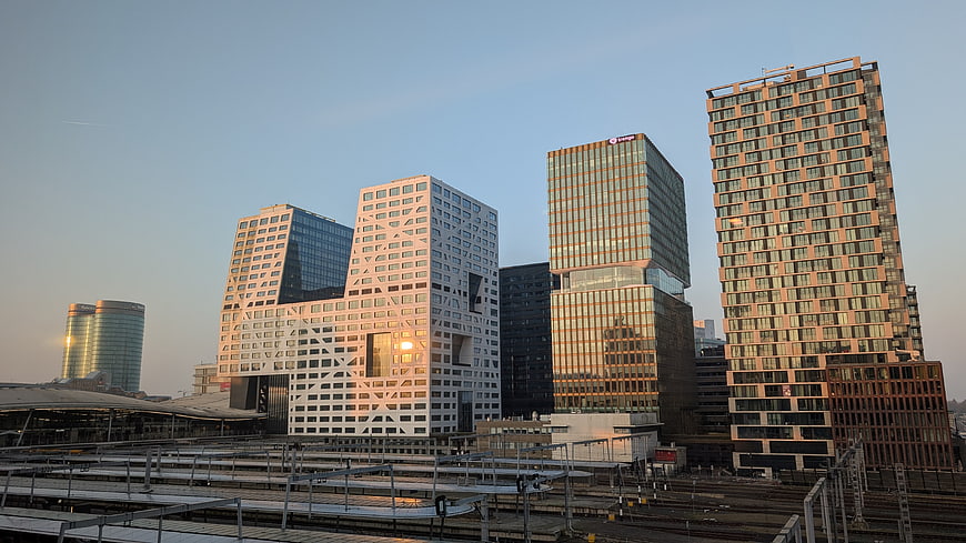 Modern city skyline with unique architecture at sunset