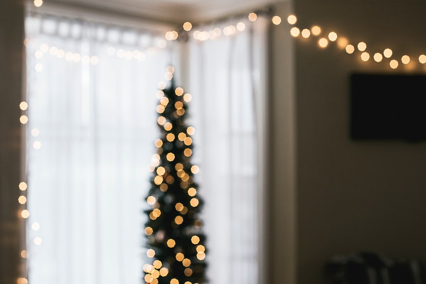 Blurred Christmas Tree with Bokeh Lights in Living Room