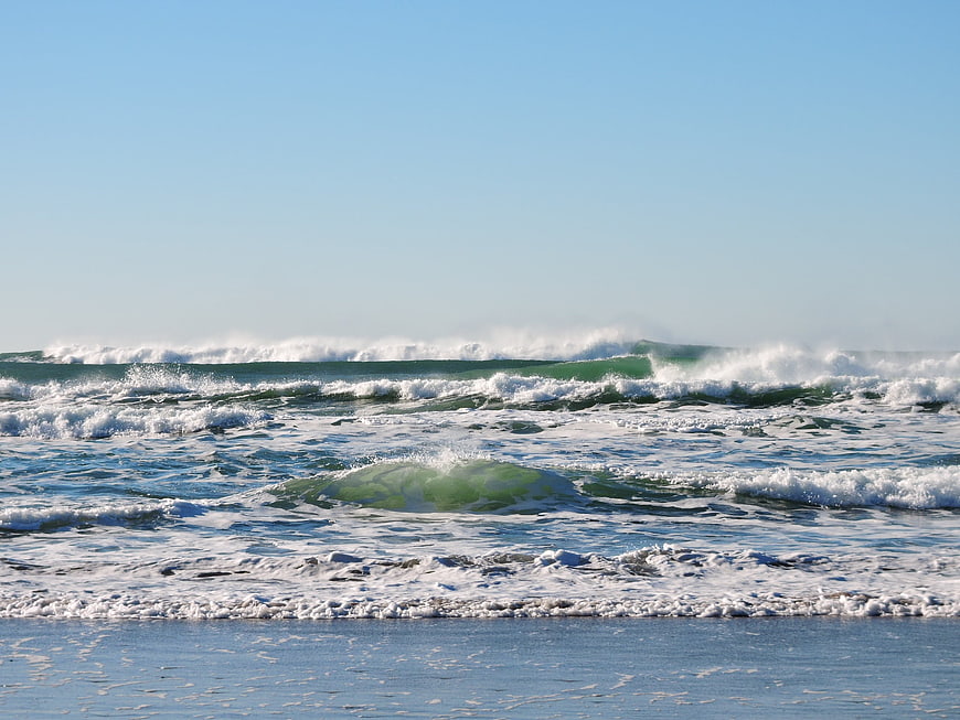 Crashing ocean waves on a sunny day at the Pacific coast