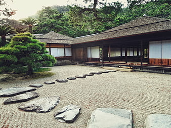 Traditional Japanese Garden with Raked Gravel and Stone Path